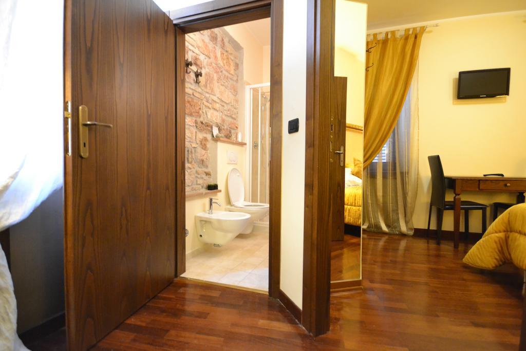 Case Brizi Asís Habitación foto